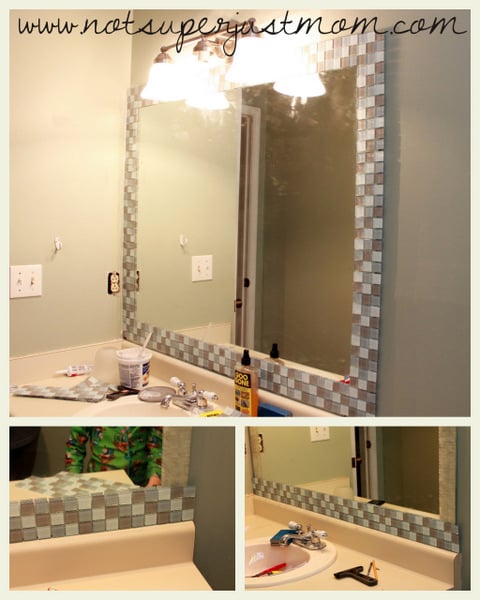 Strips of mosaic tile being pressed onto the exposed adhesive mat along the edge of the mirror