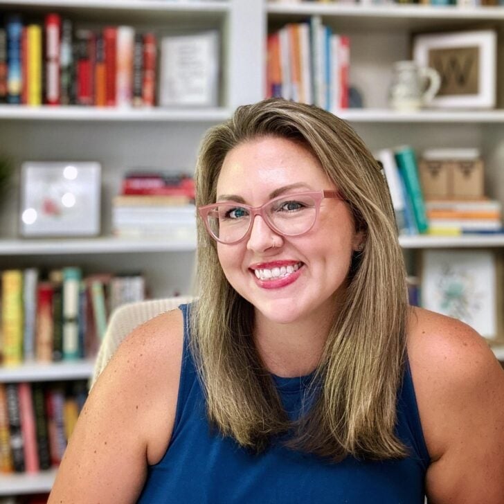 Miranda Wicker smiling in front of a bookshelf